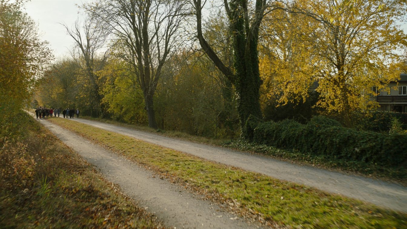 Tree-lined former railway trail through a quiet midtown Toronto neighbourhood in autumn (illustrative)